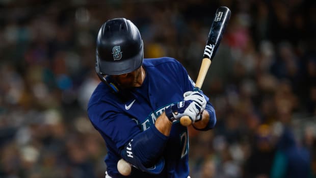 Seattle Mariners designated hitter Cooper Hummel is hit by a pitch during the fourth inning against the Cleveland Guardians at T-Mobile Park. (2023)